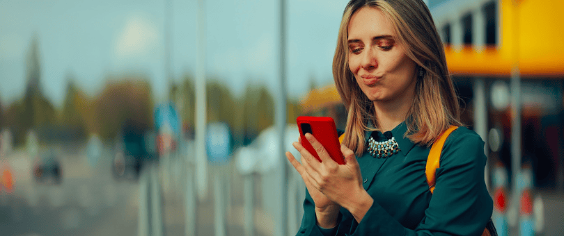 Woman with a mobile, looking like she's up to something for the SNAD and INR blog post