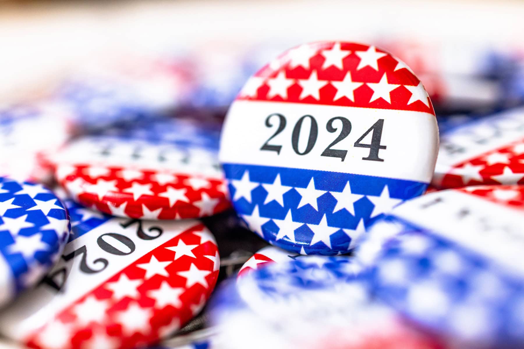 Campaign buttons with red, white and blue, stars and 2024