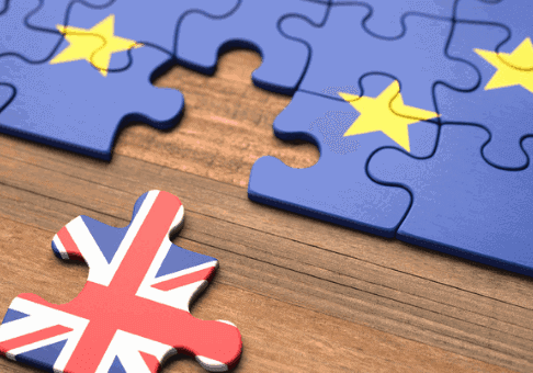 puzzle made of EU tiles with one Union Jack tile pulled away to symbolize Brexit